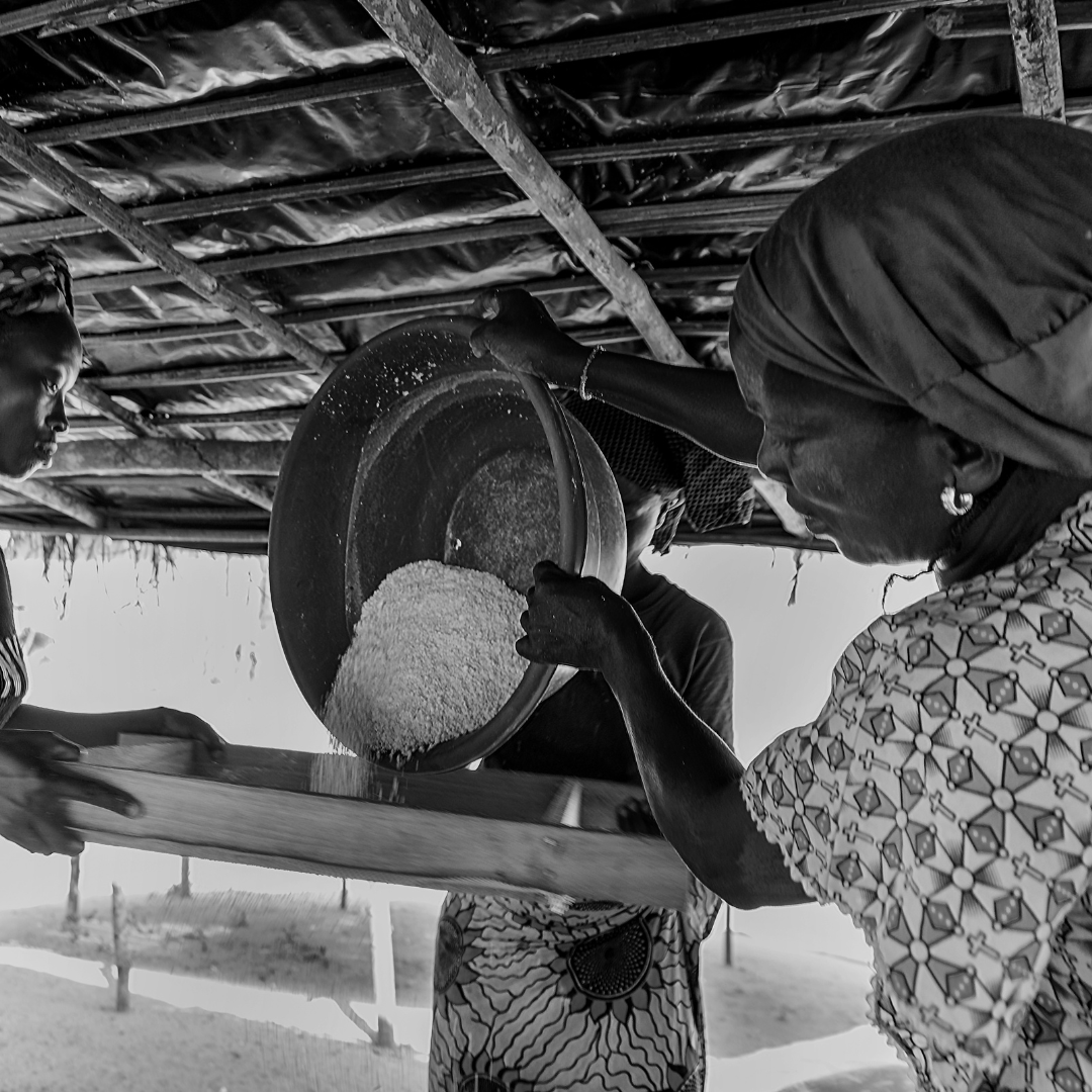 Lady pouring material out of bucket